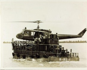 Helicopter landing aboard river boat Vietnam War. Photo Public Domain Courtesy of San Diego Air & Space Museum Archive.